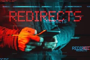 Mobile phone redirects malware concept, low key red and blue lit image and digital glitch effect